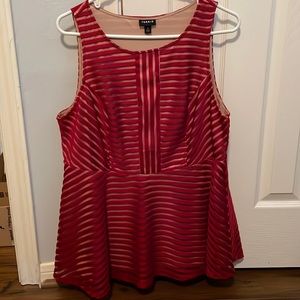 Red striped peplum top. Worn once. It’s a size 1 in Torrid sizes, 14-16.